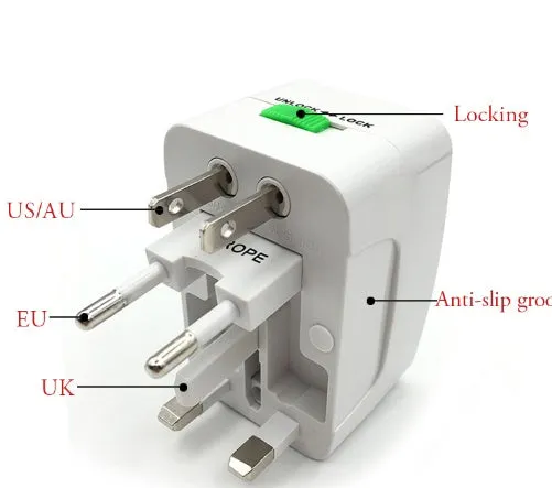 Compact white universal travel plug adapter and charger converter on a grey background.