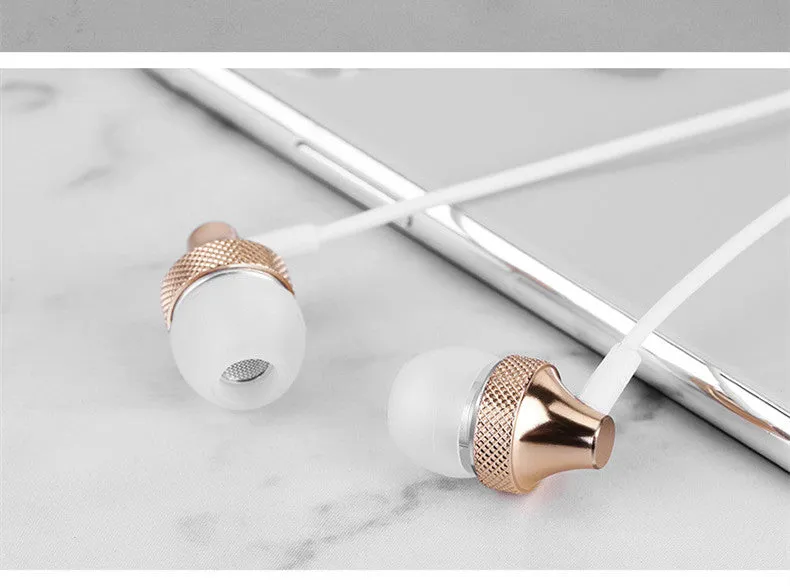 Metal in-ear headphones with wheat-coloured cable and 3.5mm plug in gold, silver, black, and red/black colours.