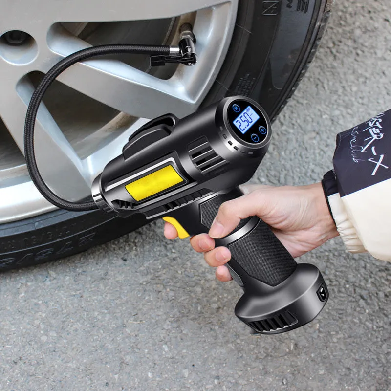 A black wireless electric tyre pump with digital display, charging cable, and air nozzles on a grey background.