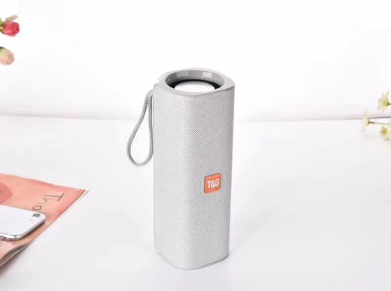 Cloth-covered portable wireless Bluetooth speaker with multiple colour options and control buttons