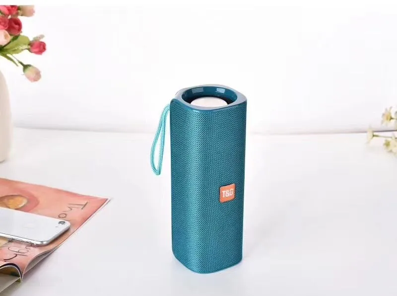 Cloth-covered portable wireless Bluetooth speaker with multiple colour options and control buttons
