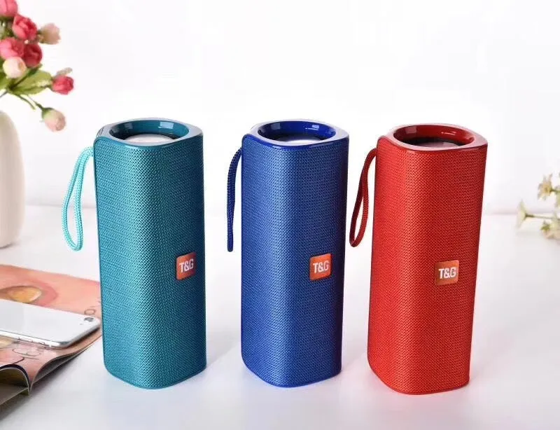 Cloth-covered portable wireless Bluetooth speaker with multiple colour options and control buttons