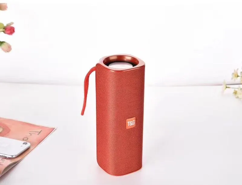 Cloth-covered portable wireless Bluetooth speaker with multiple colour options and control buttons