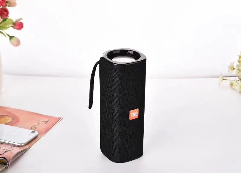 Cloth-covered portable wireless Bluetooth speaker with multiple colour options and control buttons