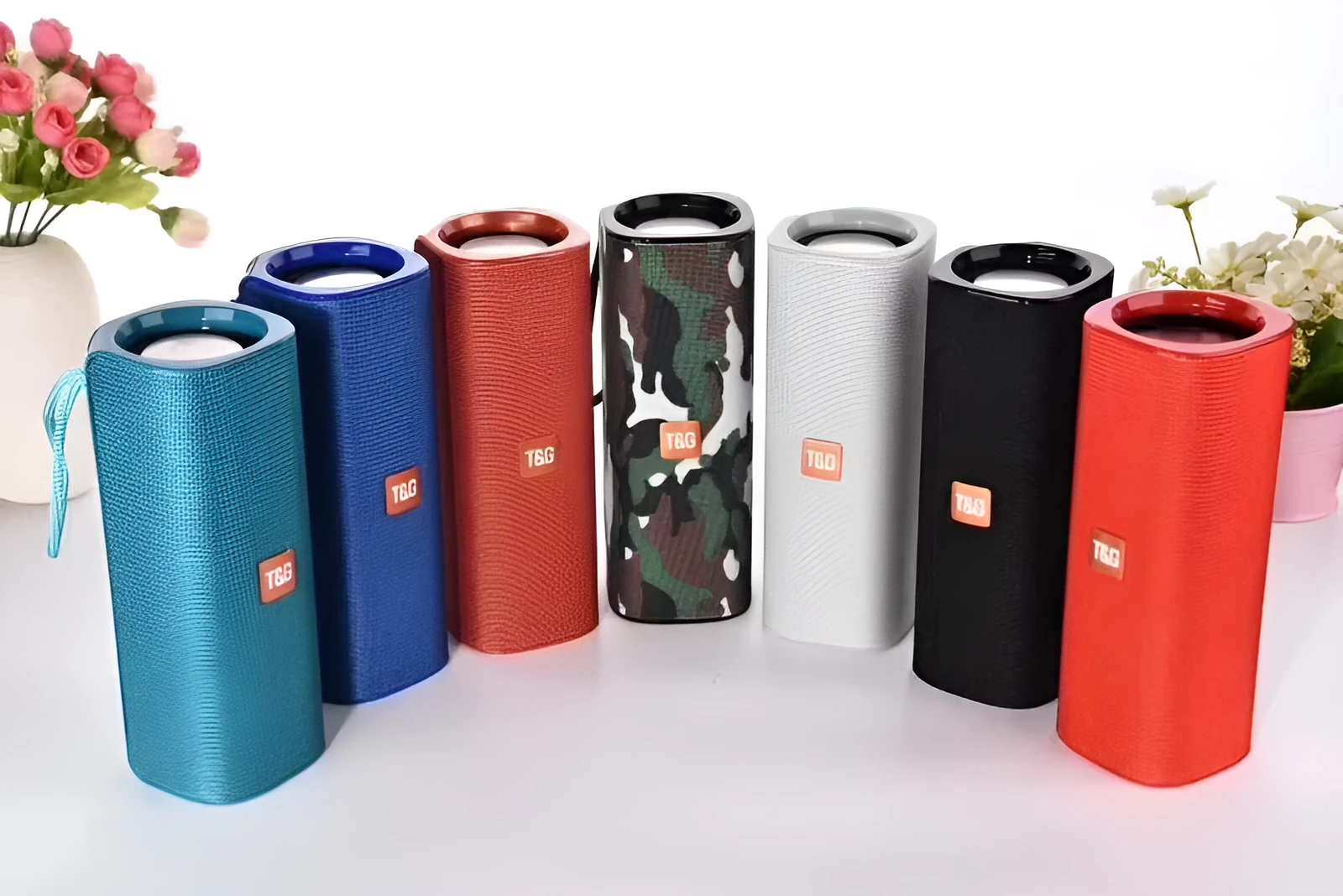 Cloth-covered portable wireless Bluetooth speaker with multiple colour options and control buttons