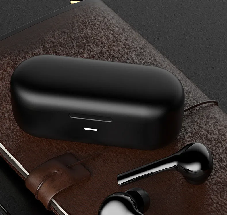 Black and white touch control wireless earbuds with a charging case on a white background