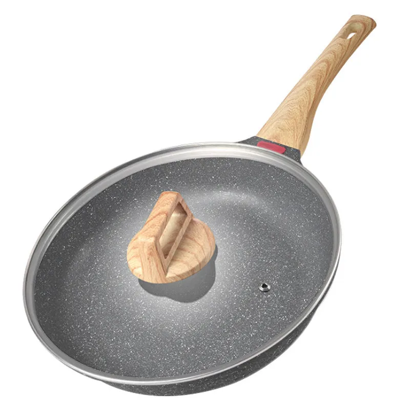 Korean style macadamite non-stick frying pan in green colour on a hob.
