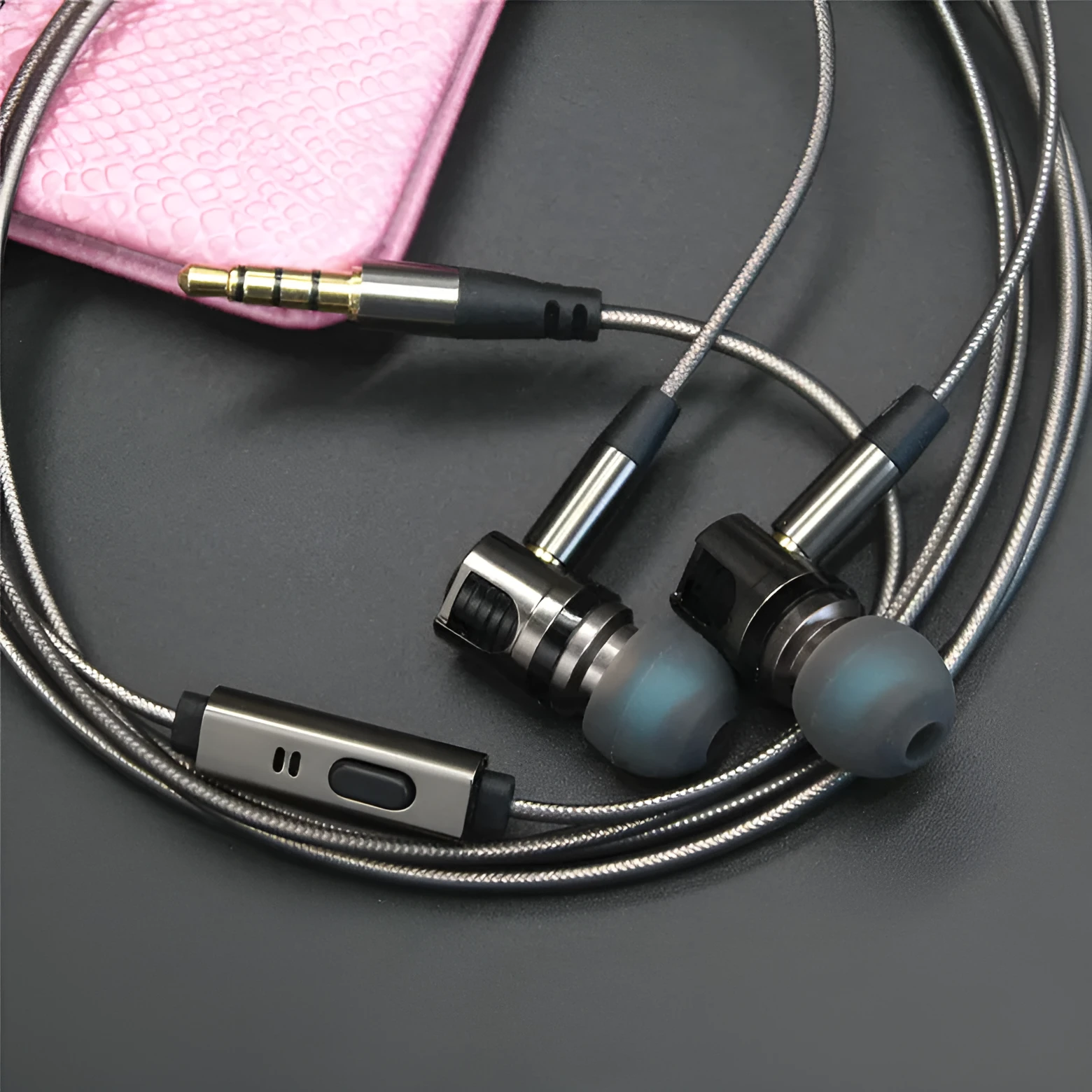 Titanium grey metal in-ear earphones with a detachable TPE cable and aluminium foil shielding.