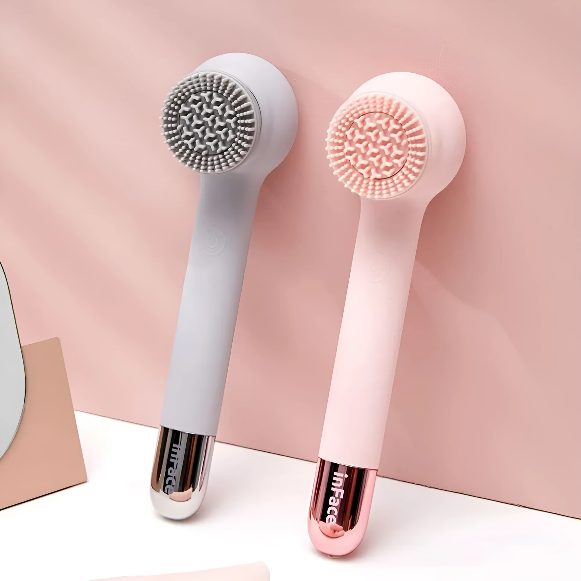 Grey electric shower brush with four rotating heads for back cleansing and massage