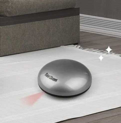Compact silver automatic vacuum cleaner robot on a wooden floor
