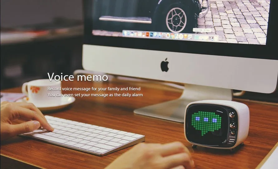 Portable Bluetooth speaker and alarm clock unit in one of six colour options: black, blue, green, pink, red, or white.