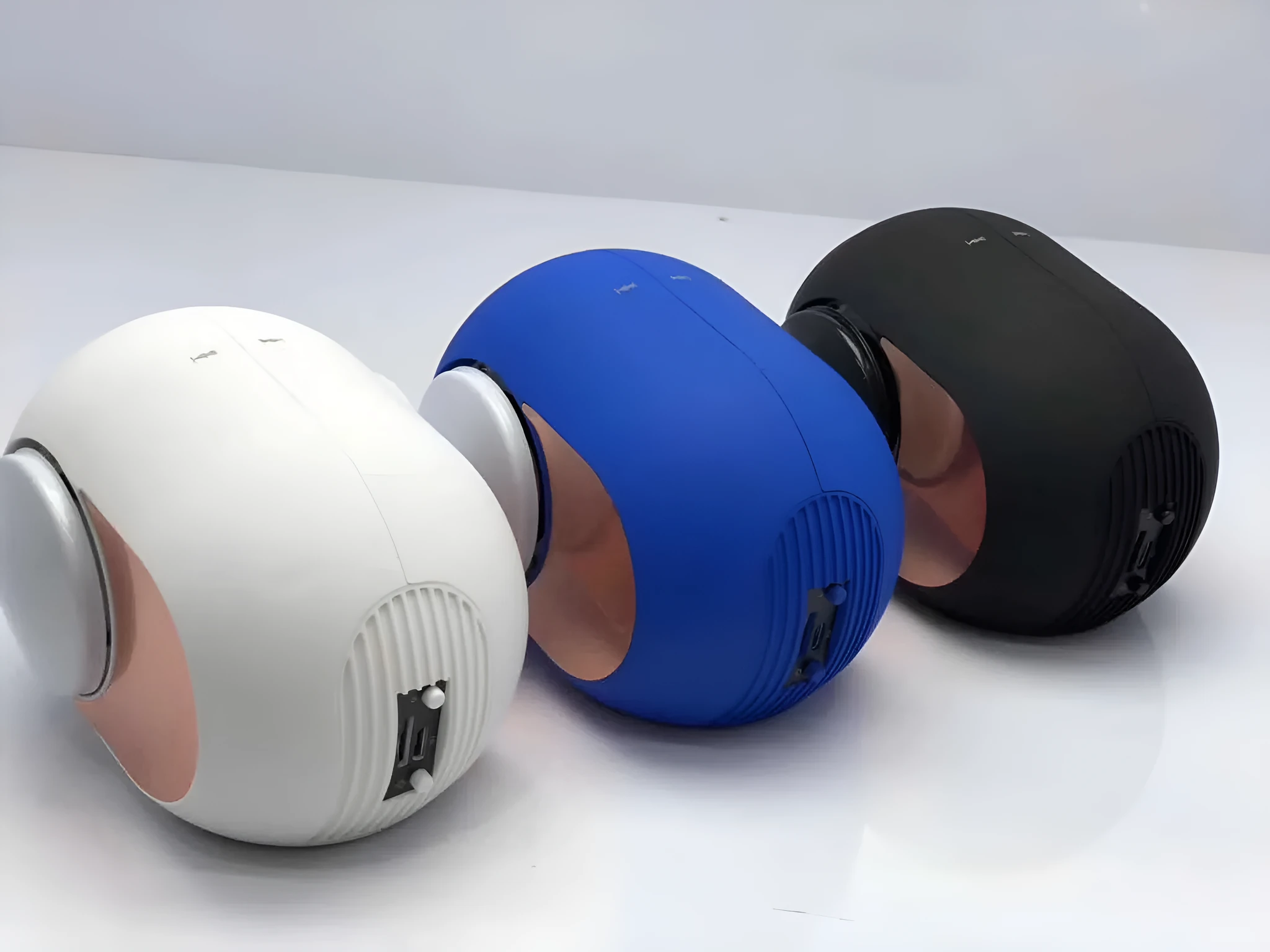 Small golden egg shaped wireless Bluetooth speaker in black, white or blue with compact portable design