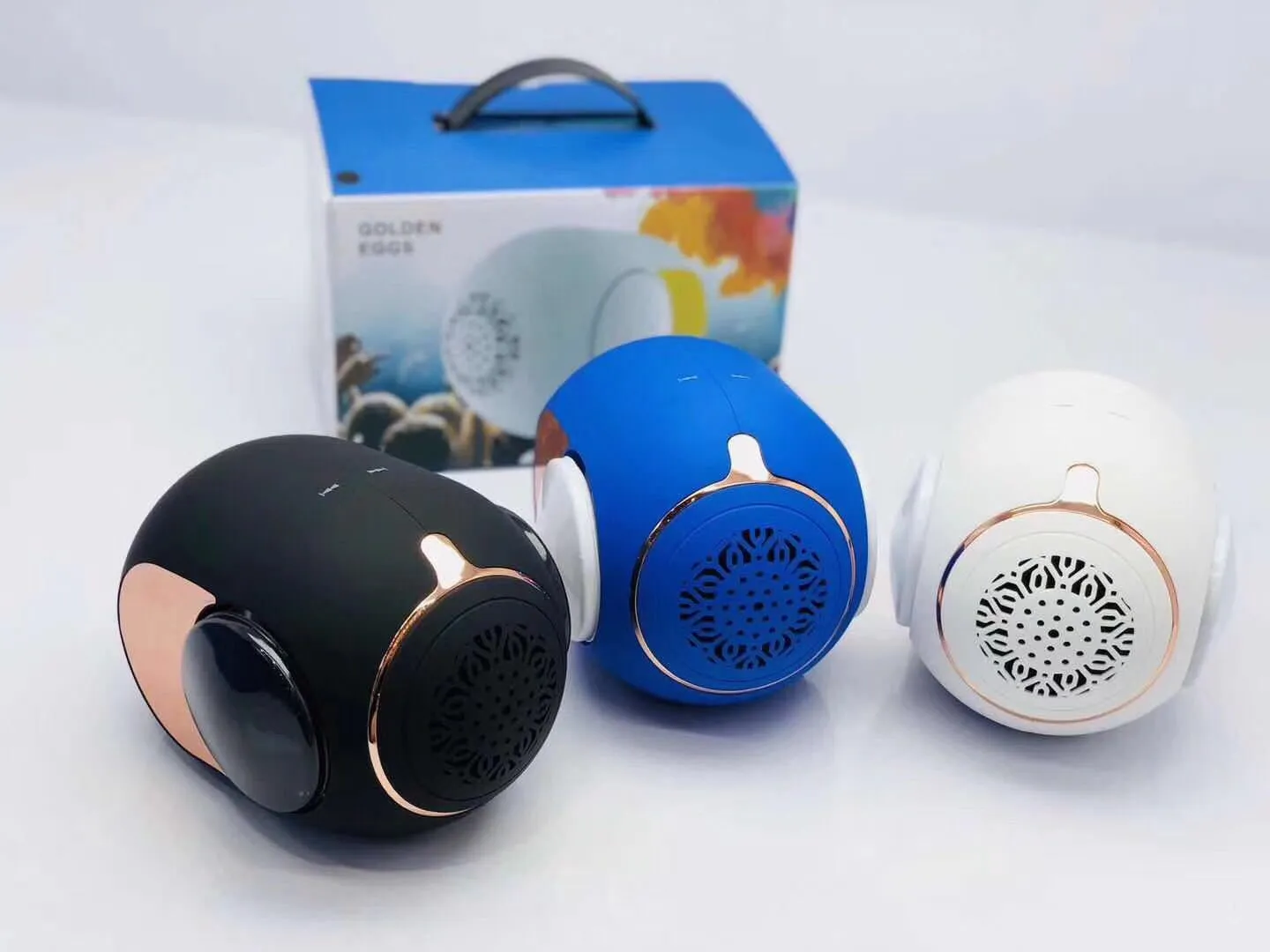 Small golden egg shaped wireless Bluetooth speaker in black, white or blue with compact portable design