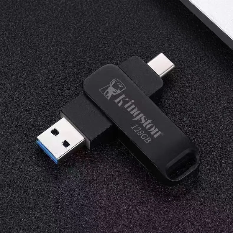 Rotating metal USB flash drive showing USB and USB-C connectors with black finish and protective iron box packaging