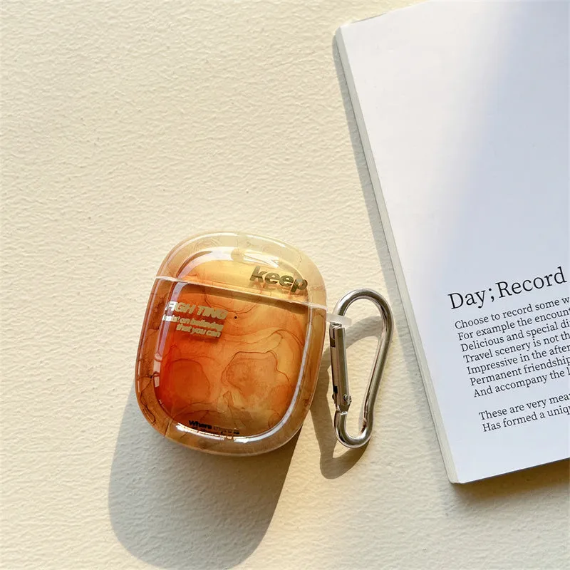Personalised black silicone AirPods case with a retro design on a table.
