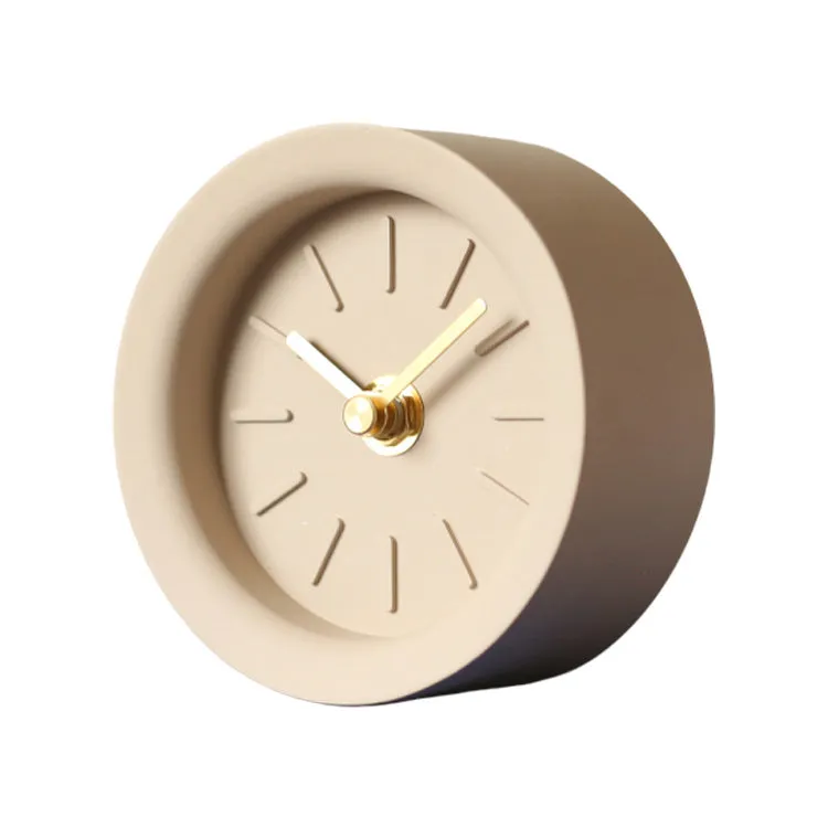 Round cement silent desk clock with Nordic minimalist design on wooden surface