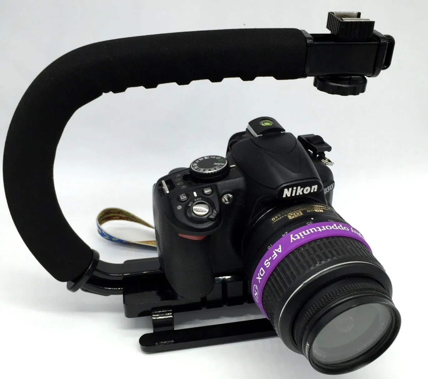 C-type handheld camera stabiliser bracket for DSLR cameras with plastic construction and sponge elements