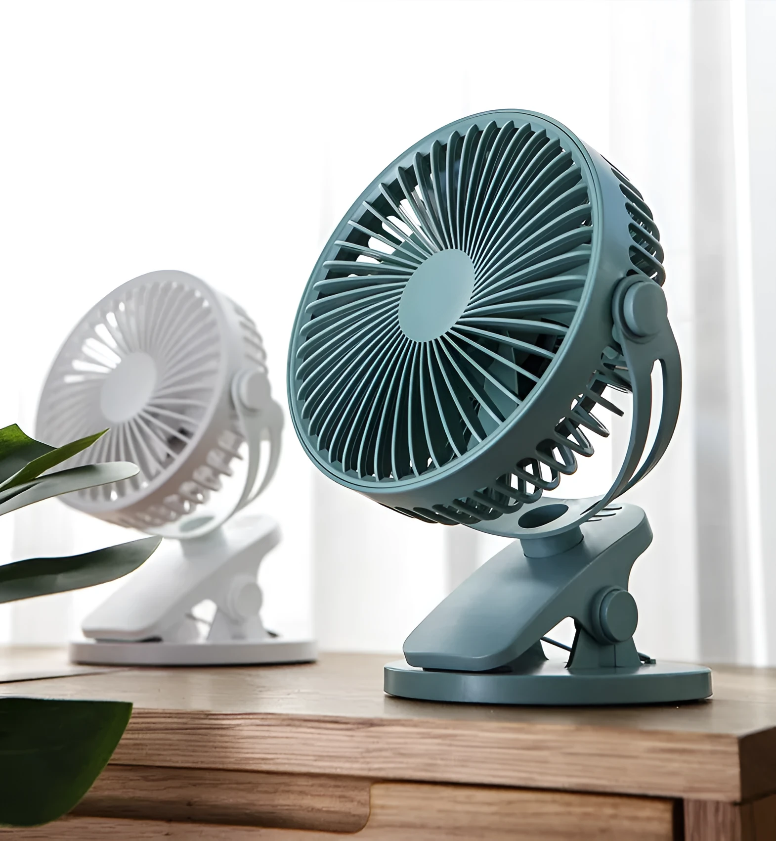 USB mini clip fan in green with clip base on wooden desk showing 135mm blade