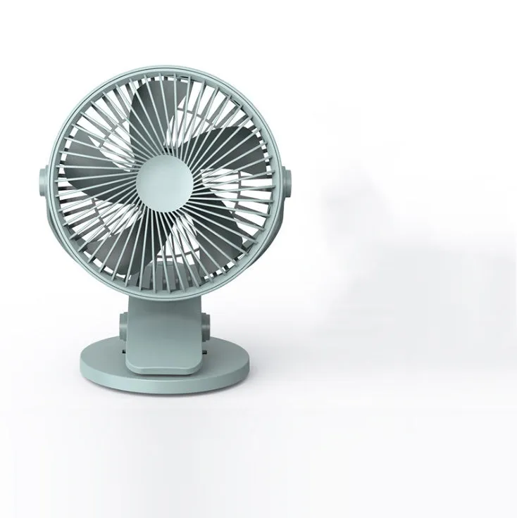 USB mini clip fan in green with clip base on wooden desk showing 135mm blade