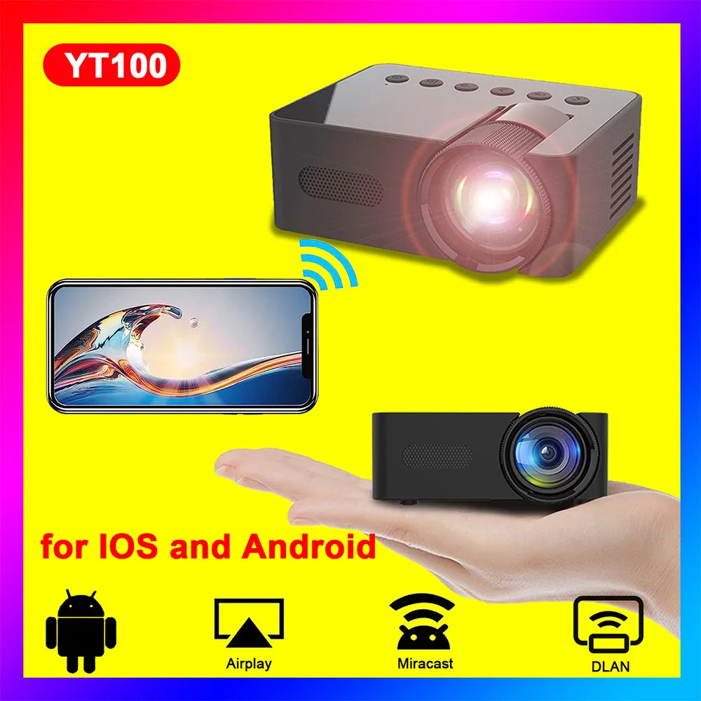 YT100 black mini portable projector on a desk with remote control and USB cable