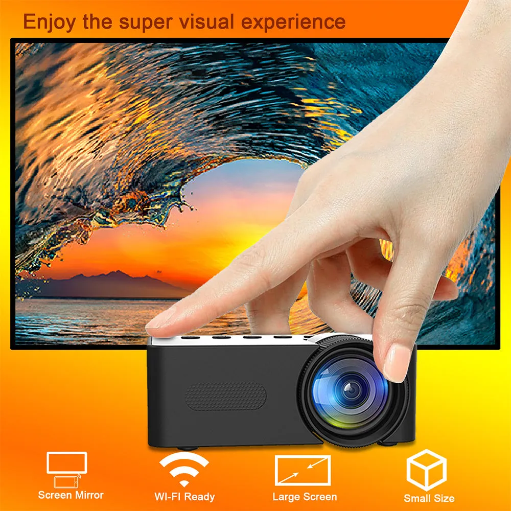 YT100 black mini portable projector on a desk with remote control and USB cable