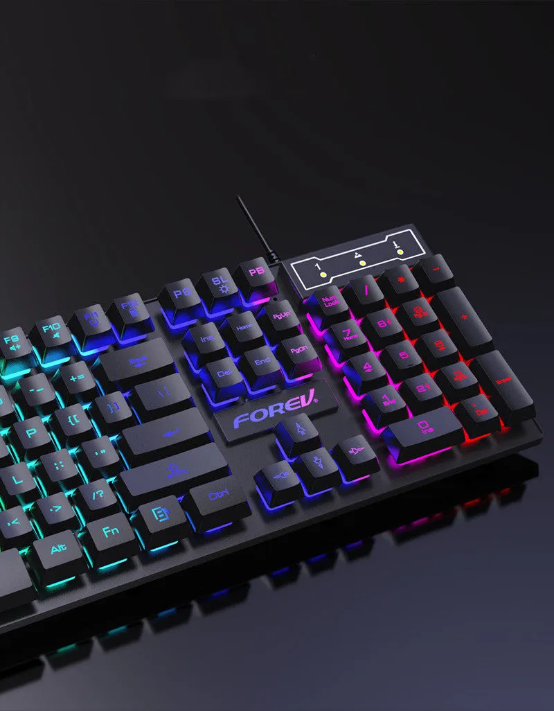 Four piece wired computer accessory set with keyboard, mouse, earphone, and mouse pad on a desk