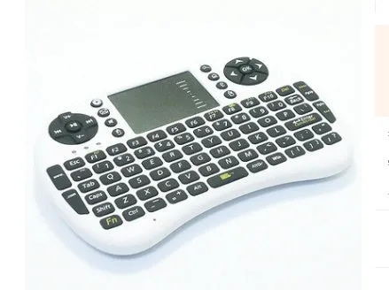 Black wireless QWERTY keyboard air mouse combo with touchpad, 146.8x97.5x19mm, on a table