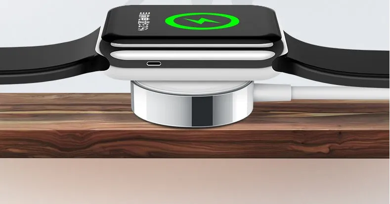 White metal Apple Watch wireless charger with 1m USB cable on a table