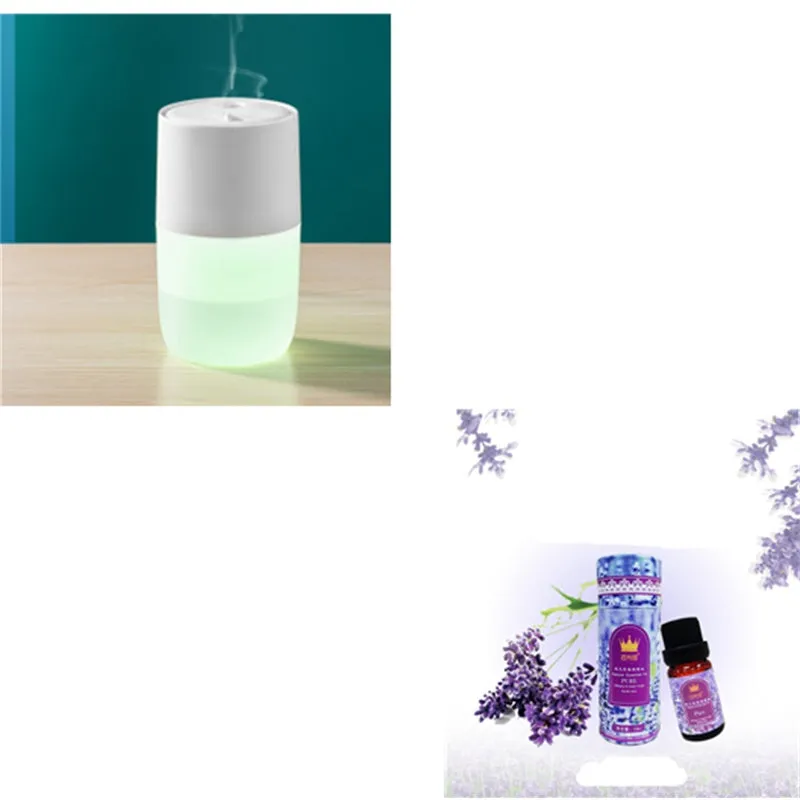 Mini portable jellyfish-shaped ultrasonic humidifier in black, with USB cable and essential oil bottle on a desktop