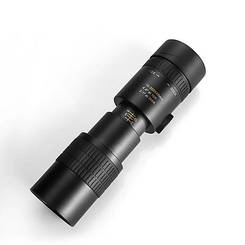 Monocular 10-300x40 zoom telescope with telescopic tripod bracket and universal mobile phone clip on a table