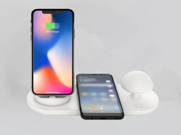 White 3 in 1 wireless charging dock with a phone on the pad and USB cable