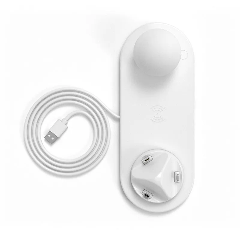 White 3 in 1 wireless charging dock with a phone on the pad and USB cable