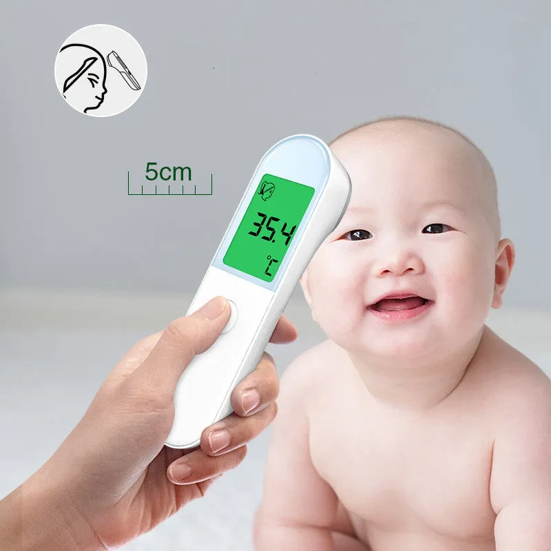 White intelligent non-contact electronic forehead thermometer temperature gun on surface