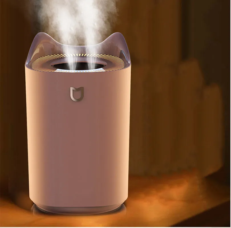 Coral Pink and Glacier White USB double spray humidifier with three mist outlets on a table.