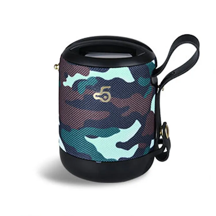 Compact black waterproof bluetooth speaker with portable belt on a table