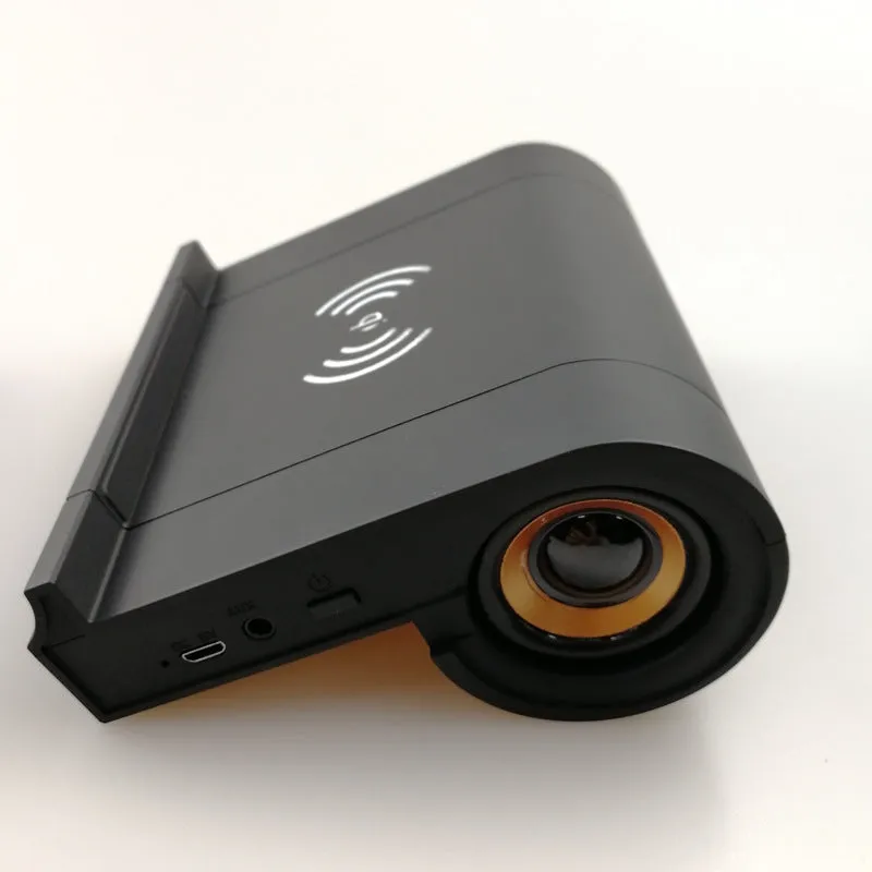 New creative wireless Bluetooth speaker in black with shaking sound and wireless charging function