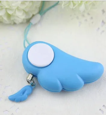 Blue personal security alarm clipped to a handbag strap, compact size 6cm x 3cm