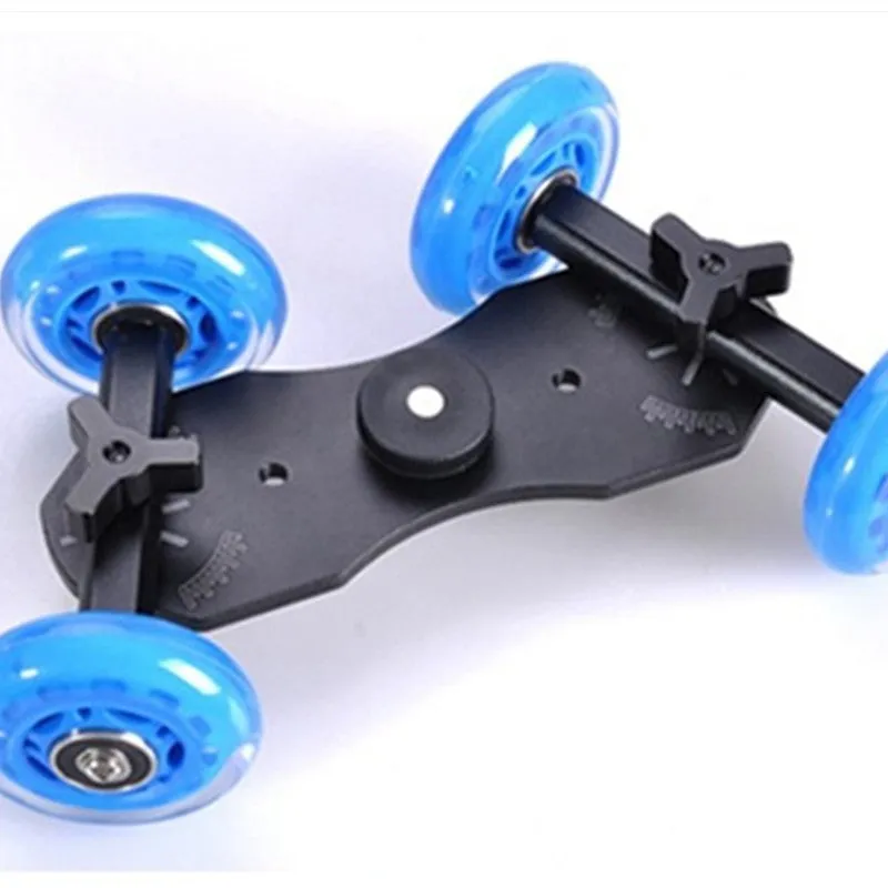 Blue dolly slider camera pulley car with solid aluminium floor, dual bearing rubber wheels, and 11inch arm on a desktop