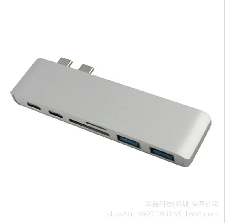 Compact USB-C hub with dual Type-C ports and SD card slot in grey aluminium finish