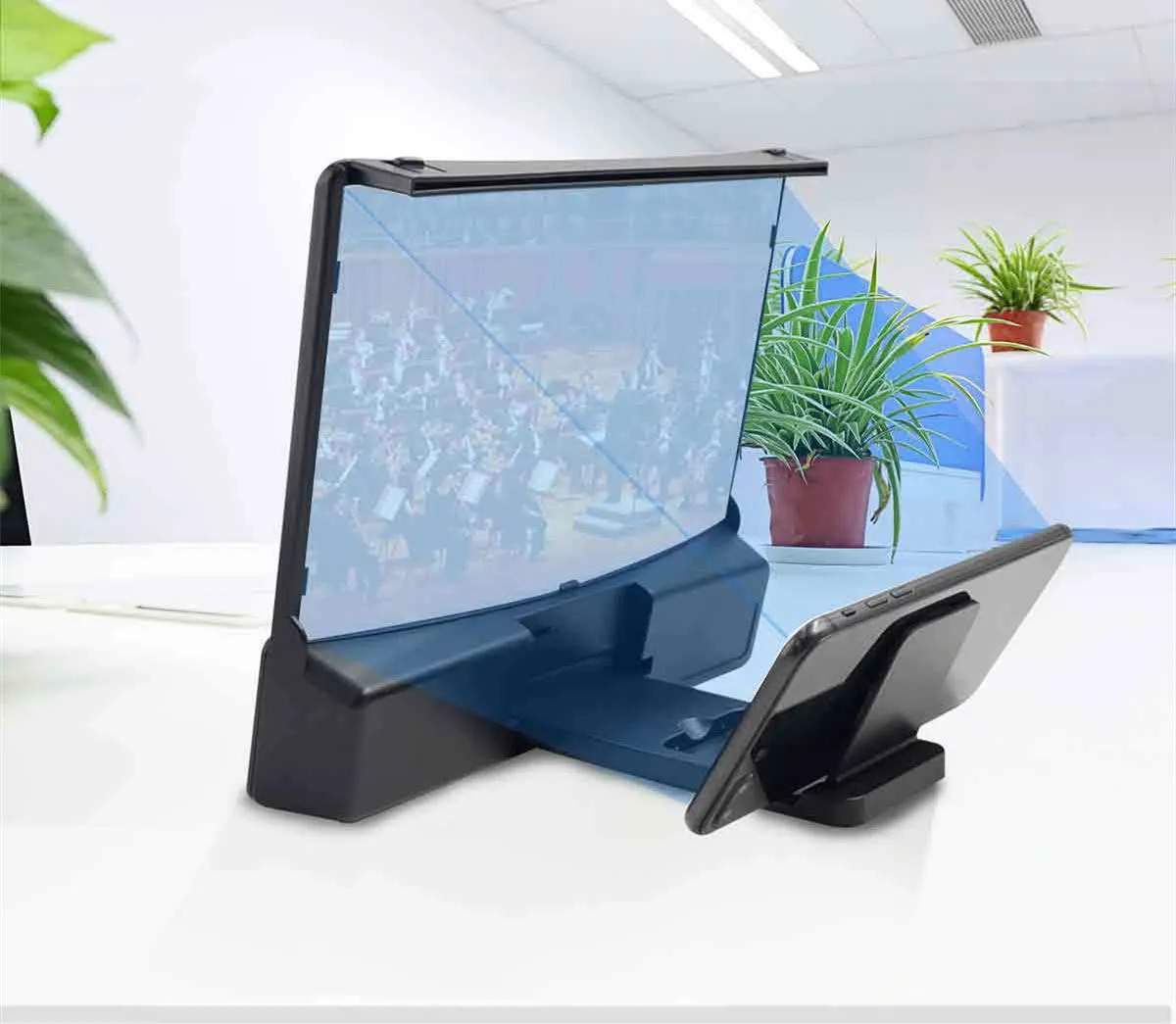 10 inch curved acrylic mobile phone screen magnifier with black ABS shell and integrated Bluetooth speaker, set on a table with a phone inside