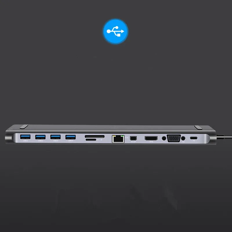 Grey aluminium alloy 12-in-1 Type-C hub with HDMI, VGA, USB 3.0, Ethernet, and PD ports on a desk