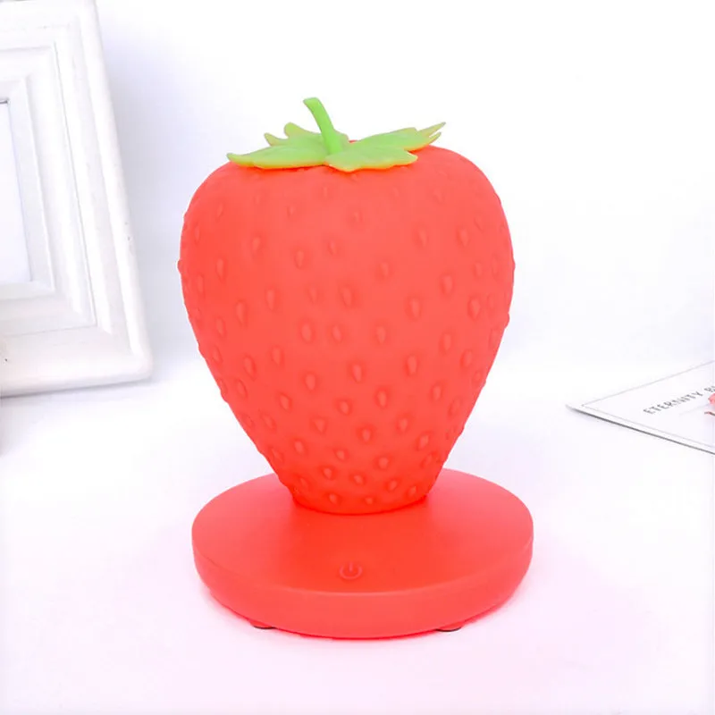 Strawberry-shaped silicone night light with USB charging, touch control, and LED glow, 10cm tall