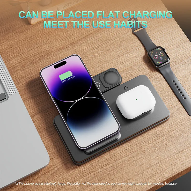 Folding bracket three-in-one wireless charger in black charging an iPhone, Apple Watch, and AirPods on a desk
