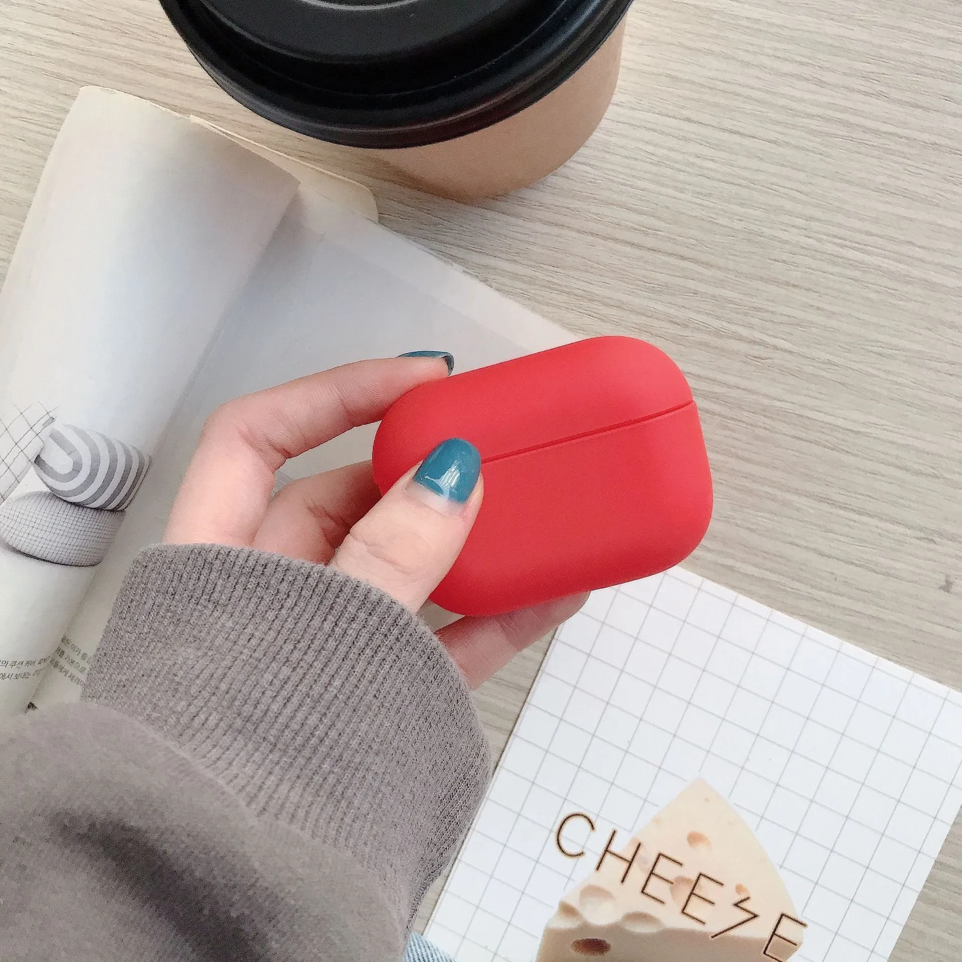 Plastic protective sleeve for AirPods case in solid colour, back-cover style with cutouts for port and lid