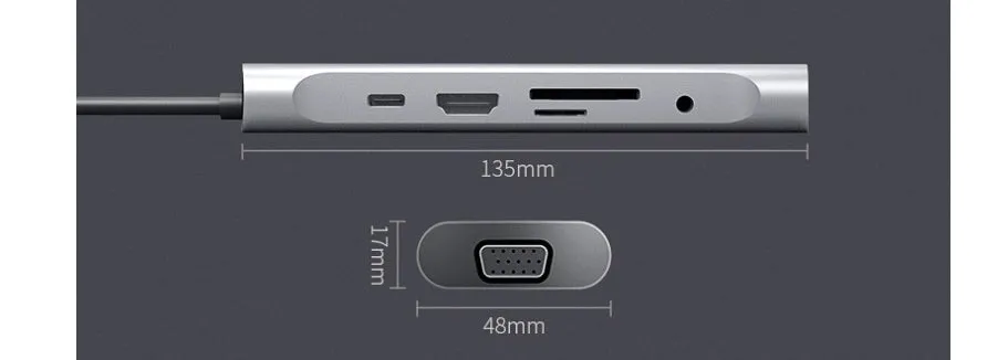 Grey aluminium USB-C docking station with multiple ports including HDMI, VGA, and USB, showing its 140mm attached cable.