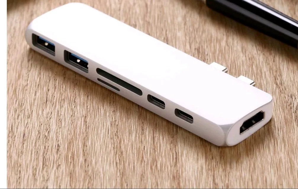 Dual Type-C seven-in-one hub in aluminium-magnesium alloy with HDMI and USB ports, 12.7cm long