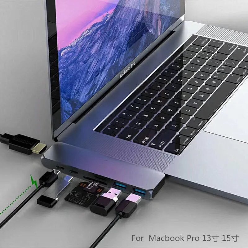 Dual Type-C seven-in-one hub in aluminium-magnesium alloy with HDMI and USB ports, 12.7cm long