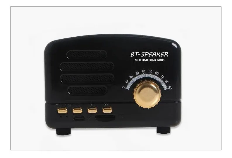 Vintage wood effect portable Bluetooth speaker in pink, black, and wood grain colours on a wooden table.