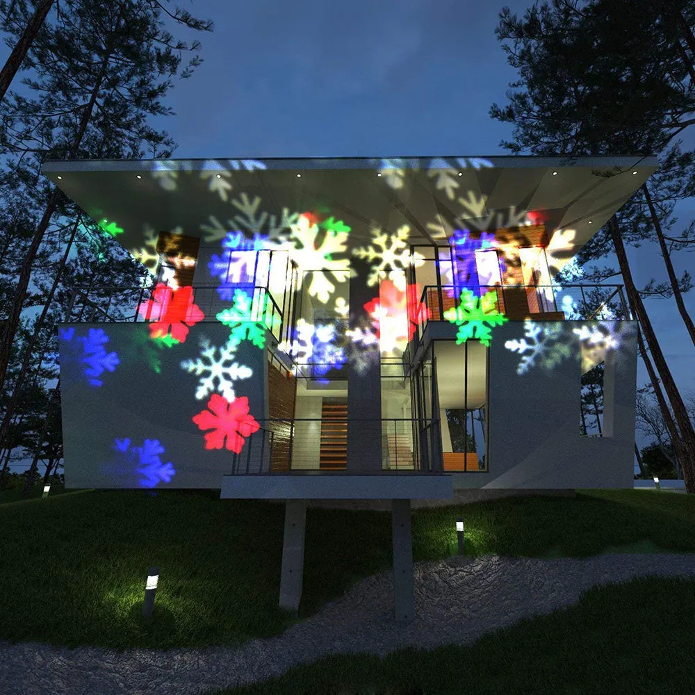 Garden Snow Lamp solar LED snowflake light with red, green, and blue multicolour glow placed in a garden lawn