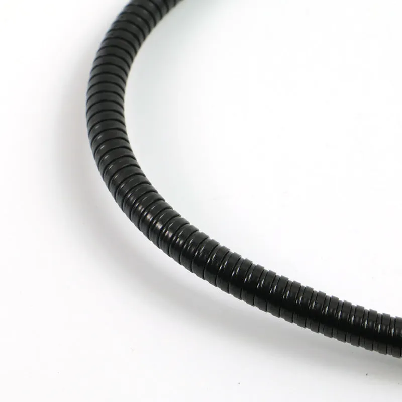 Black microphone anti-spray shock mount with elastic suspension bands on a stand